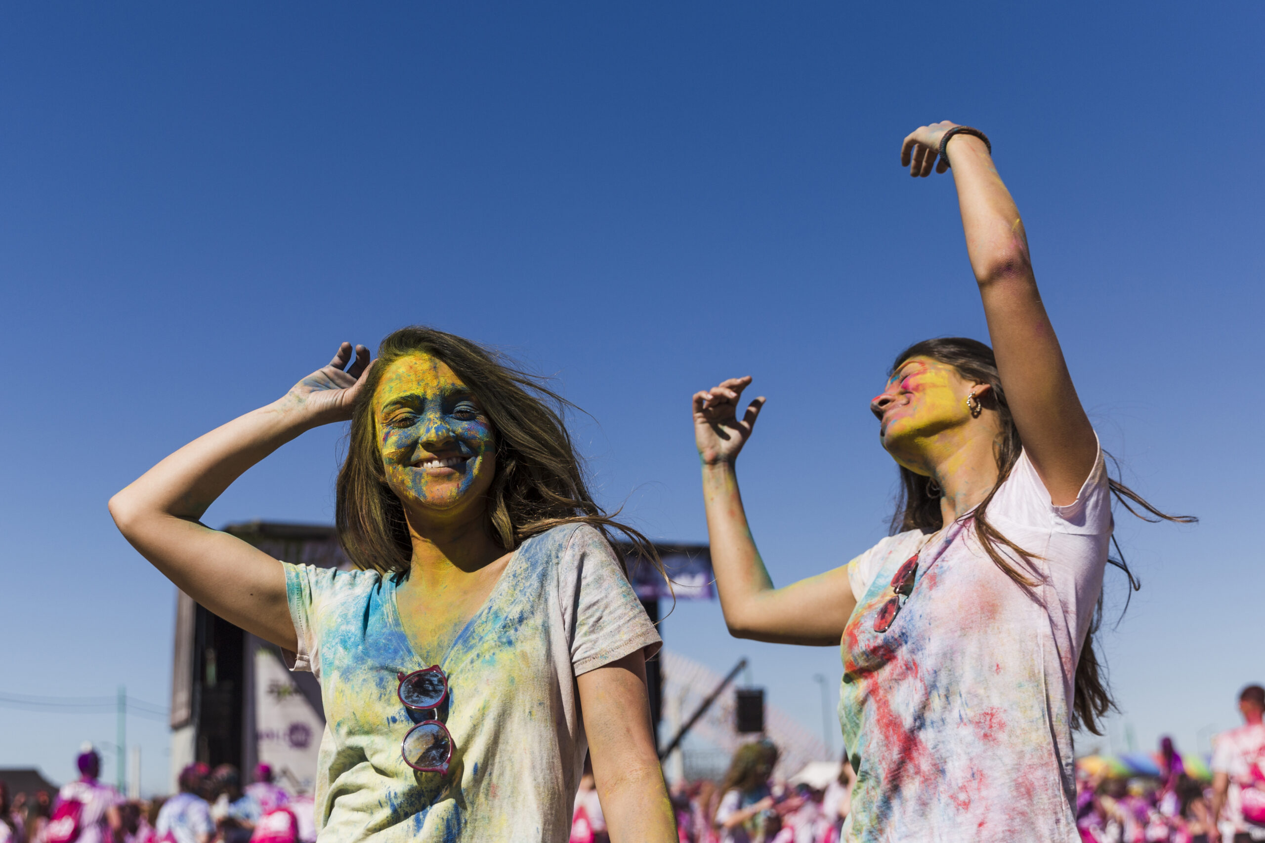 two-young-women-dancing-holi-festival